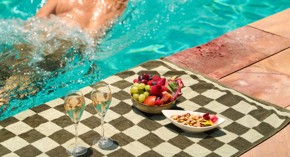A guest enjoying the pool at Pinctada Hotel.